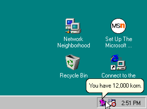 The Windows 98 icon tray. An icon shaped like a letter K says, you have 12,000 korn.
